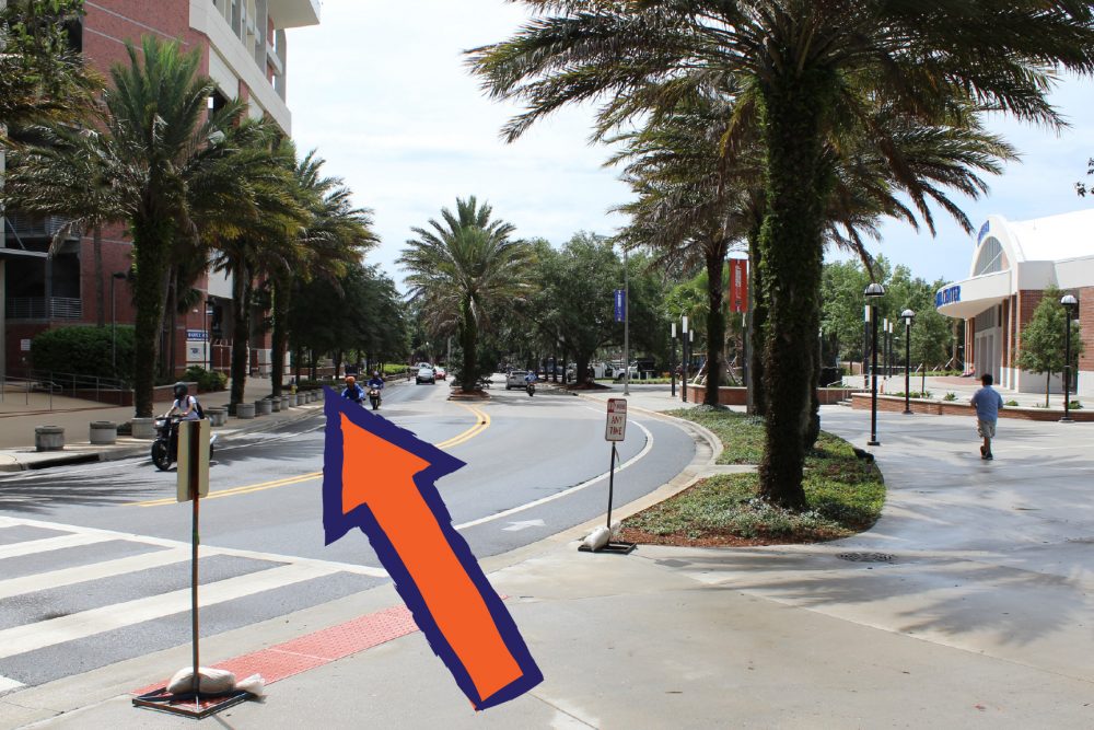 Arrow pointing toward crosswalk on Gale Lemerand Drive