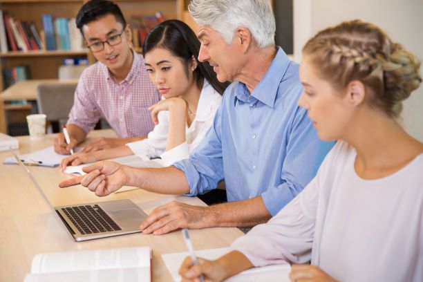 Professor providing feedback to students