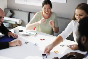 Students working together with cards on table