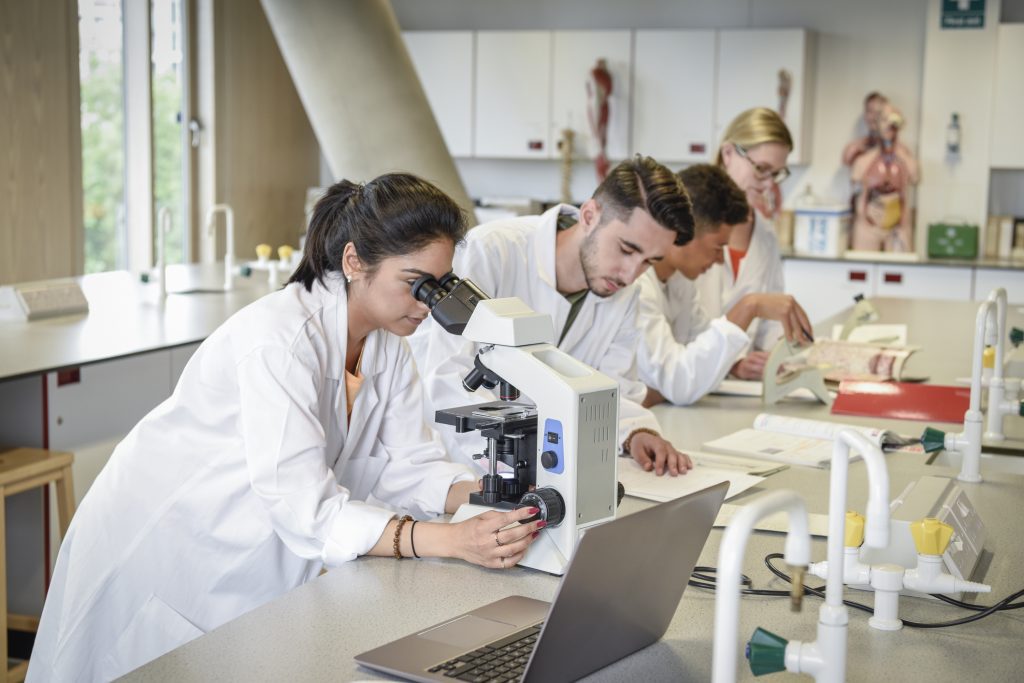 Students participating in research in a laboratory