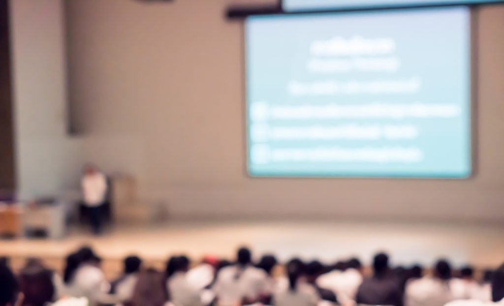 Instructor teaching a large course