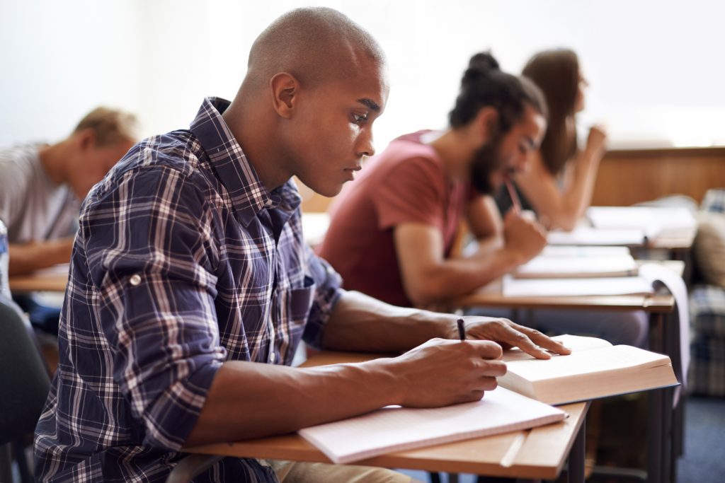 college students taking an exam