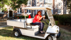 A photo of Jennifer Parker in a golf cart.